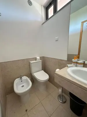 a bathroom with a toilet and a sink at Residence Golf-Vilamoura! in Quarteira