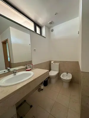 a bathroom with a sink and a toilet at Residence Golf-Vilamoura! in Quarteira