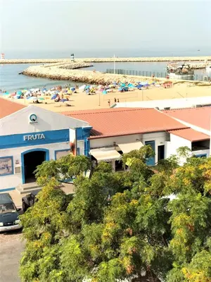 a view of a beach with people in the water at T2 Requinte e Vista Mar 4 pax in Quarteira