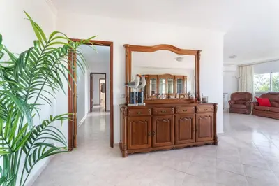 a living room with a couch and a fireplace at BnB Homes Large fully equipped Apartment with 2 bedrooms, swimming pool & patio in Albufeira