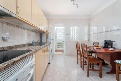 a bedroom with two bunk beds and a tv at BnB Homes Large fully equipped Apartment with 2 bedrooms, swimming pool & patio in Albufeira