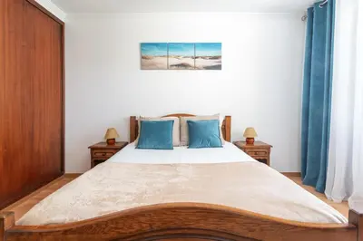 a blue tiled bathroom with a shower and a tub at BnB Homes Large fully equipped Apartment with 2 bedrooms, swimming pool & patio in Albufeira