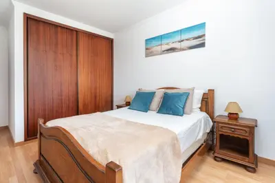 two black bottles ofodorizers sitting on a bathroom sink at BnB Homes Large fully equipped Apartment with 2 bedrooms, swimming pool & patio in Albufeira