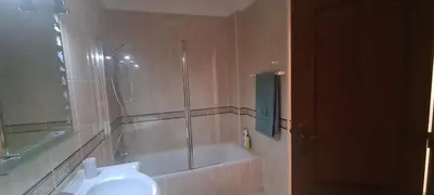 a bathroom with a shower and a tub and a toilet at Vilamoura-Quarteira Beaches Apt with pool and sea view in Quarteira