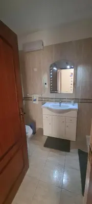 a bathroom with a sink and a toilet at Vilamoura-Quarteira Beaches Apt with pool and sea view in Quarteira