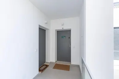 an empty hallway with a door in a building at Stunning 3 BDR Flat W/ Rooftop Pool by LovelyStay in Albufeira