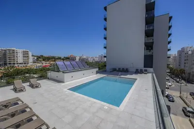 a swimming pool on the roof of a building at Terracos de Quarteira II Purple by Real Properties in Quarteira
