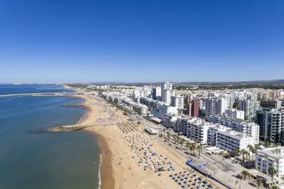an aerial view of a beach and the ocean at Terracos de Quarteira II Purple by Real Properties in Quarteira