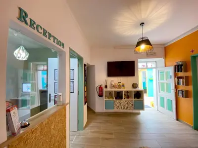 a hallway of a store with a display case at Orange Terrace Hostel in Albufeira