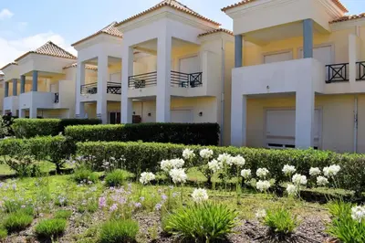 a house with a garden in front of it at Ferreiras Villa in Albufeira