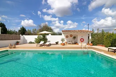 a swimming pool in front of a villa at Casa de Benafim 51 in Benafim