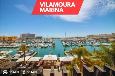 a view of a marina with boats in the water at Sea-Front 1' Min! - Apartment with AC & WiFi in Quarteira