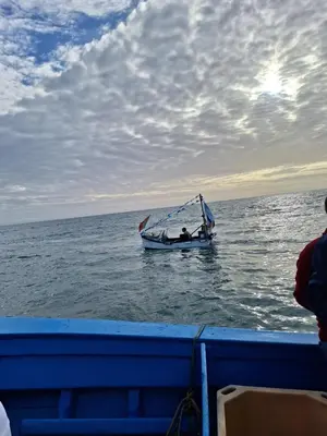 a boat in the water with a person on it at Cool living Quarteira, 2 bedroom with ocean view in Quarteira