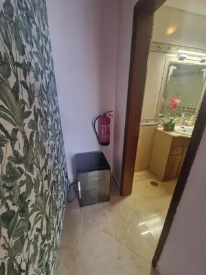 a bathroom with a toilet and a sink and a mirror at Sleep and Fly in Faro