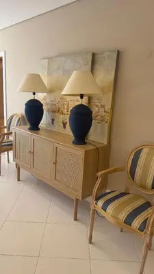 a room with two vases on a table with two chairs at Tivoli AP Casino Vilamoura in Vilamoura