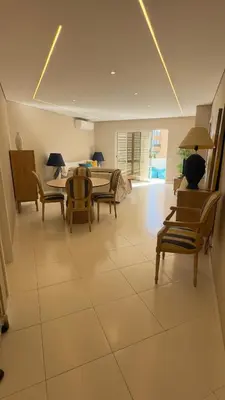 a large living room with chairs and a table at Tivoli AP Casino Vilamoura in Vilamoura
