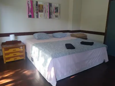a bedroom with a bed with two hats on it at Melaya Private Rooms in Faro