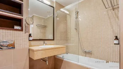 a bathroom with a tub and a sink and a shower at Greice Homes- 3 bed Luxury Apartment in Vilamoura in Quarteira
