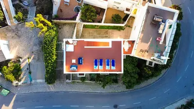 an aerial view of a house with a pool at Villa Catarina Ocean View in Albufeira