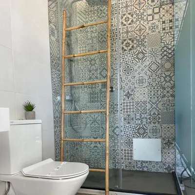 a bathroom with a toilet and a shower at Malpique heated pool & Jacuzzi Guest House in Albufeira