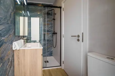 a bathroom with a sink and a shower at Atlantic Bliss in Albufeira