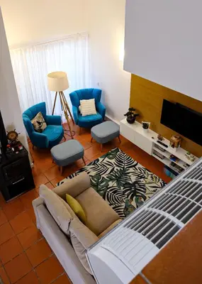 a living room with a couch and two chairs at Carpe Diem Vilamoura By Dualhotels in Vilamoura