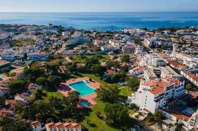 an aerial view of a city with a swimming pool at Casa da Oura in Albufeira