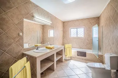 a bathroom with a sink and a toilet at Casa Pluma in Albufeira