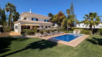 a house with a swimming pool in the yard at Villa Pinetree Seaside, Albufeira in Albufeira