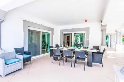 a dining room with a table and chairs at Villa Paris in Terras Novas