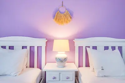 a bedroom with two beds and a lamp on a night stand at Seaside Retreat with Pool, AC, and Fast Wi-Fi in Albufeira