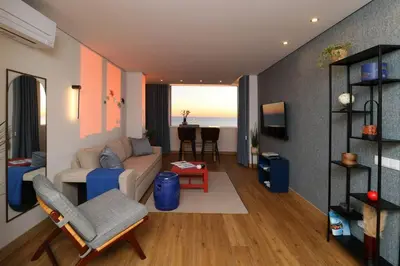 a living room with a couch and a table at Blue over blue in Quarteira
