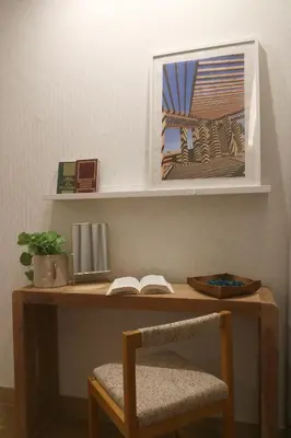 a wooden desk with a chair and a book at Blue over blue in Quarteira