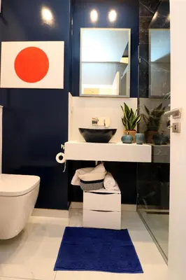 a bathroom with a sink and a toilet at Blue over blue in Quarteira