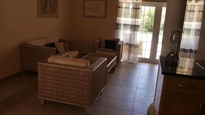 a small yellow house with a driveway at Villa with pool children Very welcome Algarve Portugal for 10 people in Quarteira