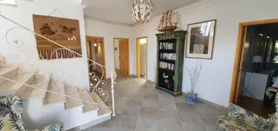 a hallway with a spiral staircase in a house at Villa Arquete 6 seat Jacuzzi 5 min walk to shops in Guia