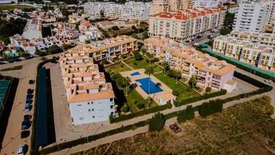 an aerial view of a city with buildings and a street at Serene Apartment W/ Balcony and Pool by LovelyStay in Quarteira