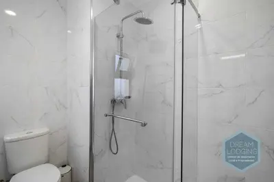 a bathroom with a shower with a toilet at Vila Magna 109 - Dream Lodging in Albufeira