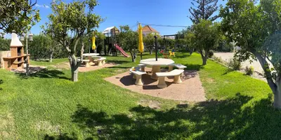 a park with several picnic tables and a playground at CH 1 e 2 Two Apartments Up To 10 Guests Casa da Horta, T1 & T2 in Albufeira