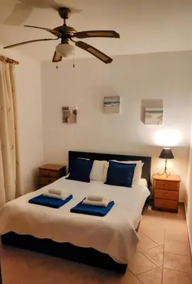 a bedroom with a bed with two trays on it at Villa Oliandra in Vilamoura