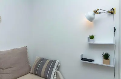 a living room with a lamp and a couch at Açoteias 203 in Albufeira