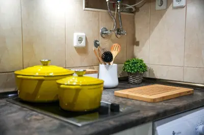 two yellow containers sitting on a counter in a kitchen at Açoteias 203 in Albufeira
