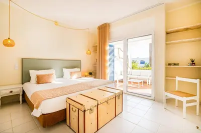 a living room with a white couch and a tv at Apartment Vento in Albufeira