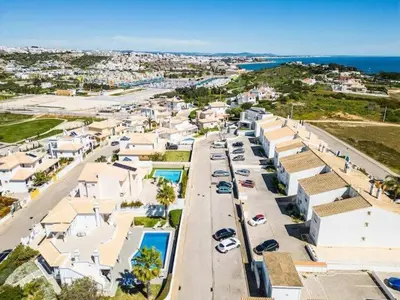 an aerial view of a city with houses and cars at Villa Redonda in Albufeira