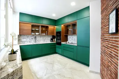 a kitchen with green cabinets and a brick wall at Green Algarve Gem Spacious 2 BDR By Misha's Place in Faro