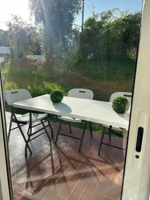 a white table and chairs on a patio at Pateo AL Albufeira in Albufeira