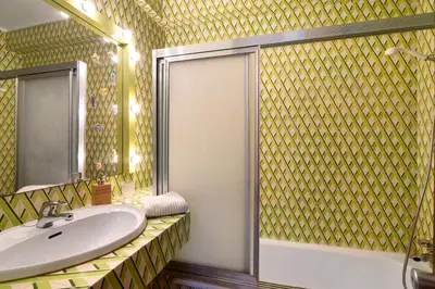 a bathroom with a sink and a shower at Good Wave House in Vilamoura