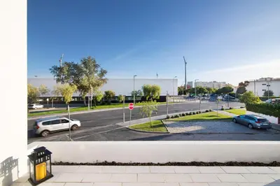 a view of a parking lot with cars parked at Good Wave House in Vilamoura