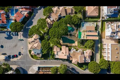 an overhead view of houses and trees in a neighborhood at Falésia Modern Flat W/Balcony & Pool by LovelyStay in Albufeira