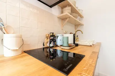 a kitchen with a counter with a coffee maker at Amália Boutique Suites & Studios - by @ rita´s place in Faro